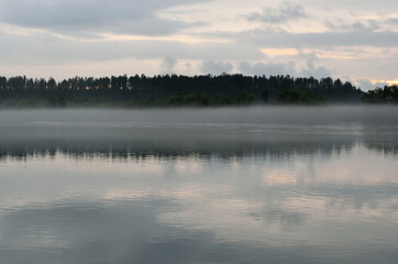 Fototapeta premium heavy mist over river landscape