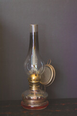 old oil lamp on wooden table
