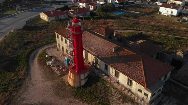 DRONE AERIAL FOOTAGE - Conservation and restoration work taking place on the Farol de Esposende (Esposende Lighthouse) set in front of the Fort of Sao Joao Baptista de Esposende, Portugal.
