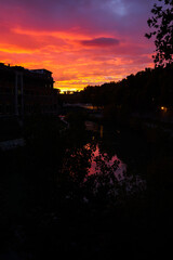 Silhouette of the city at sunset over the Tiber river in Rome