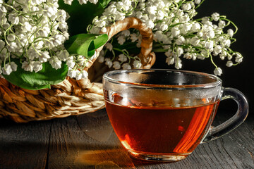 Lily of the valley on dark wooden table
