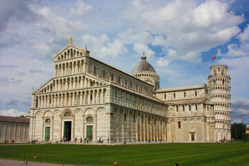 Fototapeta na wymiar cathedral of the pisa tower on the grass of piazza dei miracoli