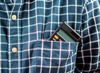 A business shirt with a calculator in pocket