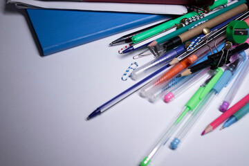 notebooks and pencils, felt-tip pens and paper clips. stationery concept. copy space. isolated