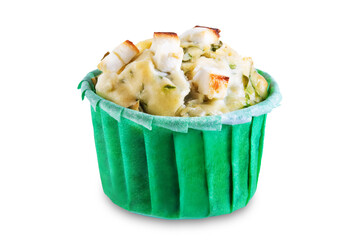 Spinach Feta cheese breakfast muffins with fresh spinach leaves on a white isolated background