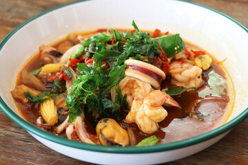 stir-fried seafood (shrimps and squid) with basil leaves, thai street food