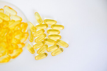 Yellow capsules of vitamin omega 3. Dietary Supplement. Fish oil in capsules.