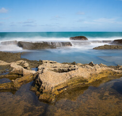 waves crashing on rocks - long exposure