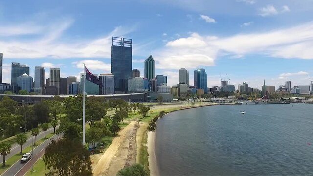 Beautiful drone shot flying towards Perth CBD in Western Australia on a gorgeous summers day, blue skies with few clouds. (Wide shot)