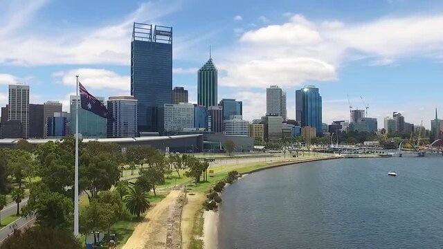 Beautiful drone shot flying towards Perth CBD in Western Australia on a gorgeous summers day, blue skies with few clouds. (Zoomed in)