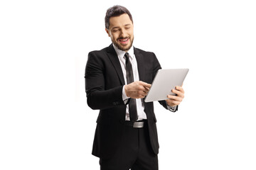 Professional man in a black suit pointing at a tablet