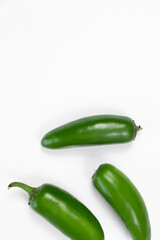 green peppers on white
