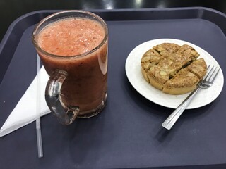 Refreshing cocktail drink with cake.