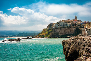 The famous "Pearl of the Gargano" scenic view of the old town of Vieste, carved into the rock, Apulia.Italy
