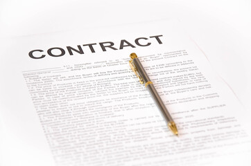  pen and contract on a white background. signing a contract