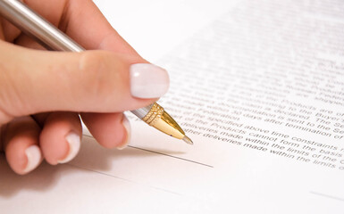  pen and contract on a white background. signing a contract