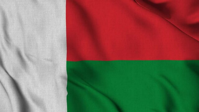 madagascar national flag waving with fabric texture fluttering in wind in a seamless loop in smooth slowmotion animation background