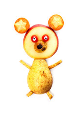 Food art creative concepts. Funny bear made of pear, apple, carrots, tomatoes, grapes and raisin isolated on white background