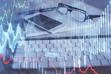 Double exposure of forex chart drawing and cell phone background. Concept of financial trading