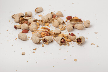 shells of peanuts on a white background