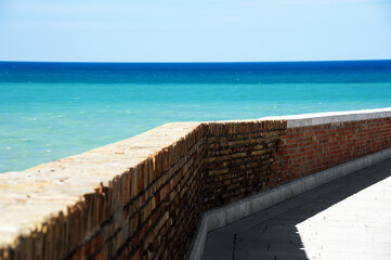Fototapeta premium View of a typical city street overlooking the beautiful sea, Termoli a tourist town on the Adriatic Sea in the province of Campobasso, in the Molise region, southern Italy