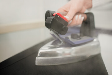 Ironing the clothes close up