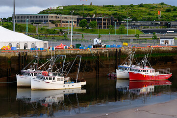 Fishing boats at dawn and low tide in Saint John Harbour New Brunswick