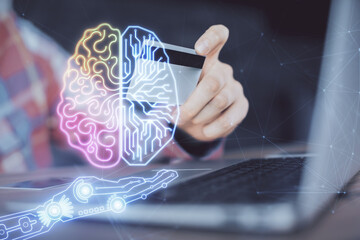 Double exposure of man hands typing on computer with credit card and brain theme drawing....