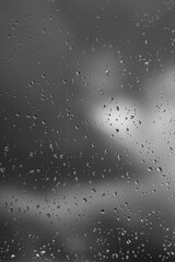 raindrops on window black and white