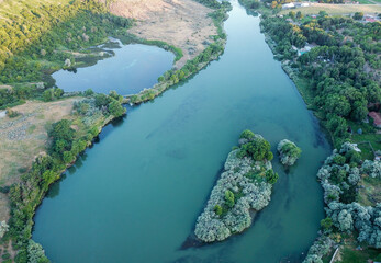 Aerial view of a river, a pond, and some islands.
