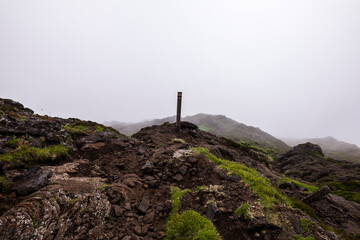 The views and beautiful landscape seeing trekking signs while hiking to Mount Pico (Montanha do Pico) in Pico Island, Azores, Portugal