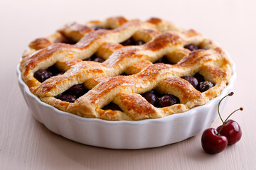 Freshly baked cherry pie in a pan