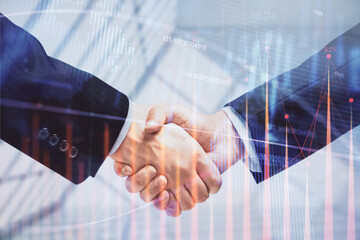 Double exposure of forex graph hologram and handshake of two men. Stock market concept.
