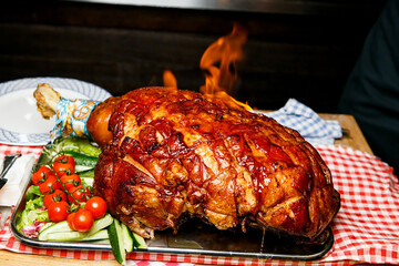 Grilled Schweinshaxe German Pork Knuckle in restaurant.