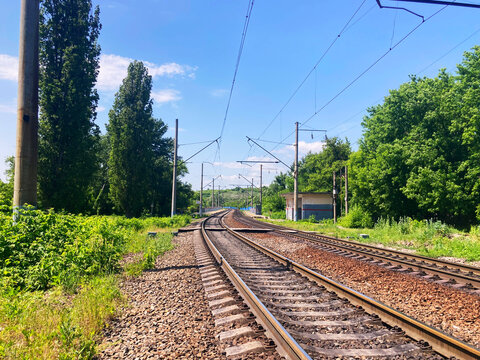 Railway tracks in countryside. Railway on sunny summer day.