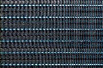 blue hydrophilic coaterd heat radiator - air conditioner evaporator close-up coil texture