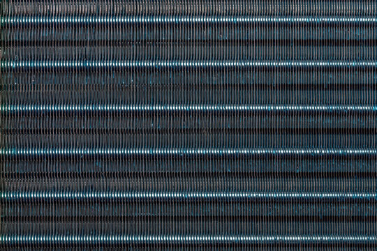 blue hydrophilic coaterd heat radiator - air conditioner evaporator close-up coil texture