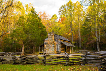 Grear Smoky Mountains National Park, Tennessee, a restored historic log cabin with a split rail fence. © Bob
