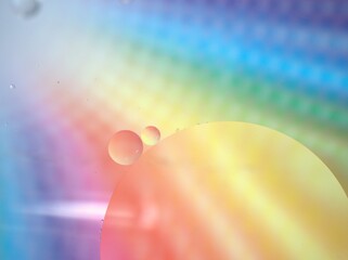 Closeup oil bubbles with colorful background and blurred ,macro image ,sweet pastel color ,rainbow and colorful balloons background, abstract background