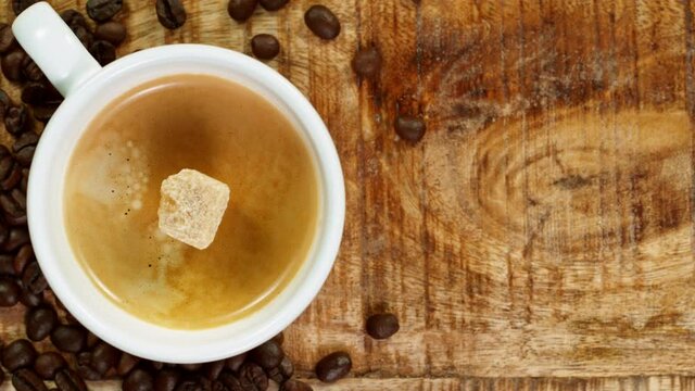 Falling sugar cane into coffee cup, super slow moton at 1000 fps.