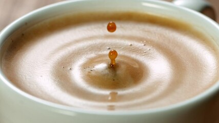 Falling sugar cane into coffee cup, super slow moton at 1000 fps. - Powered by Adobe