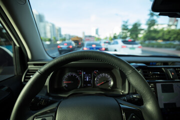 Driving car on city road awaiting in front of the zebra crossing