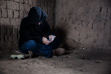 Man hand holds plastic packet or bag with Drug