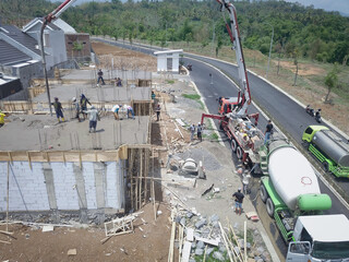 shooting using a drone camera on the second floor of a residential area shop using a casting truck.