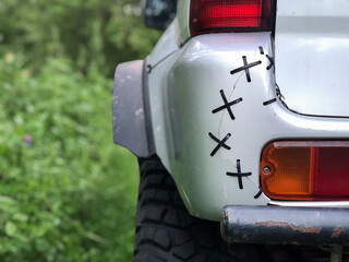 Low-quality repair of the bumper of a 4wd four-wheel drive car. Connection of parts and components, the stitching. seam, with your own hands. funny artisanal, the owner just sewed a piece of plastic