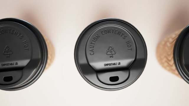 Seamless looping animation of assorted paper cups. Top view at disposable cups.