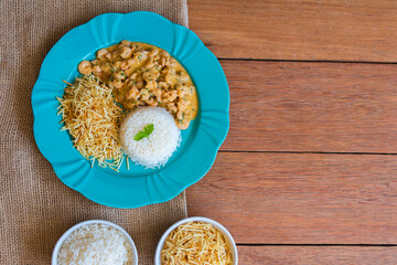 Food plate with shrimp stroganoff. Wood background.