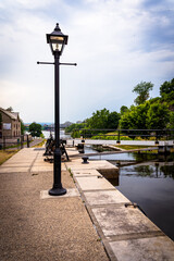Very old street lamp in Canada by water canals