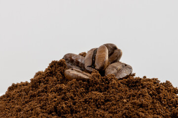 Fototapeta premium coffee beans and ground coffee with white background