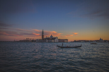 Naklejka premium Sunset in Venice and gondola, Italy